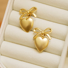 Load image into Gallery viewer, Matte Gold Plated Ribbon Heart Earrings